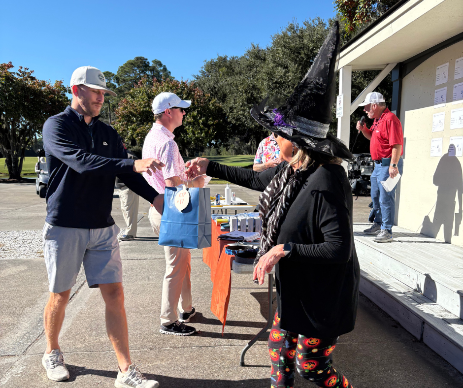 Old South 34th Anniversary Golf Tournament contest winners receiving prizes.